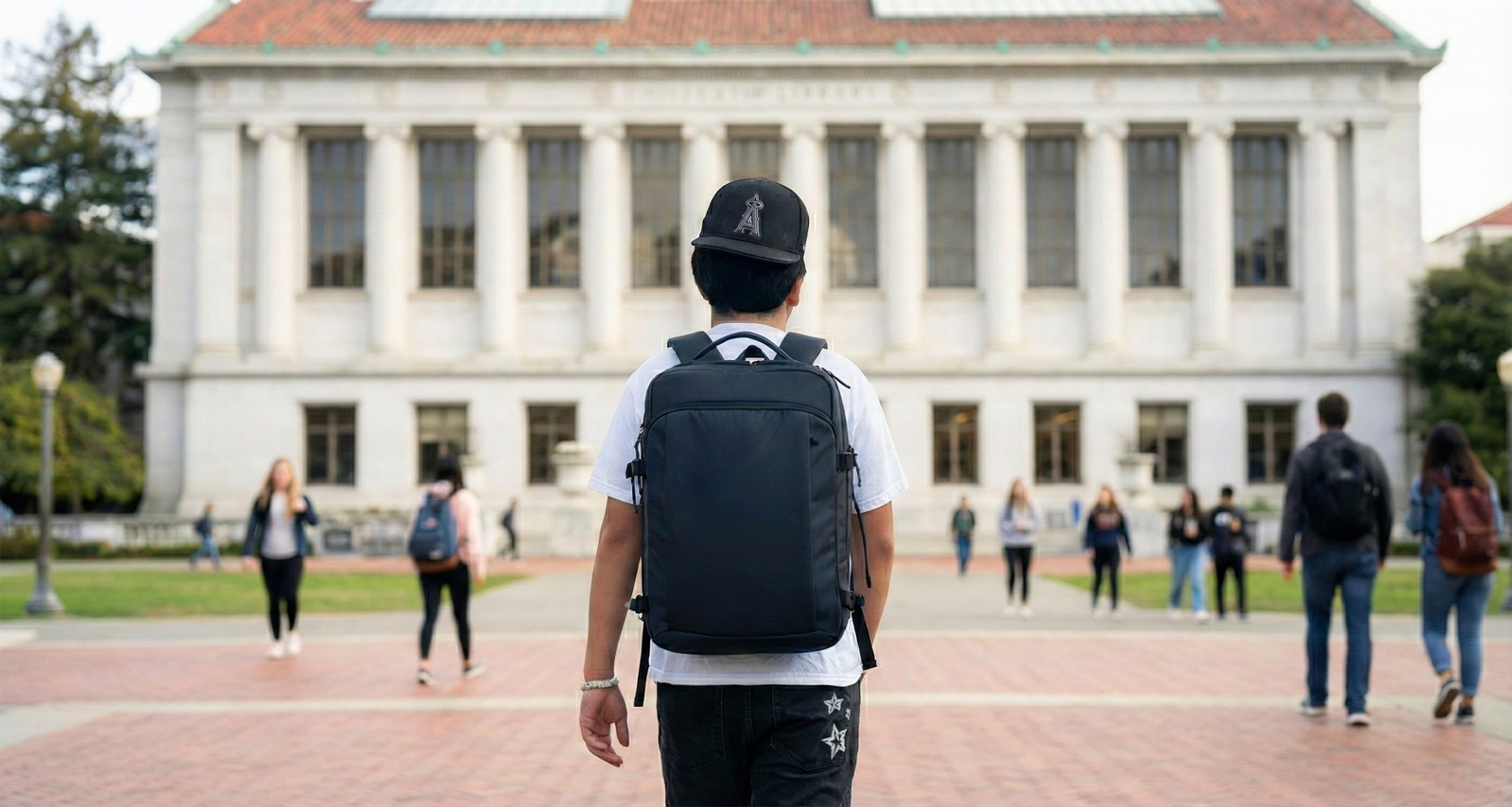 Student wearing black bulletproof backpack on campus